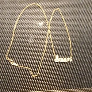 dream with small cz's.Gold tone chain, very dainty